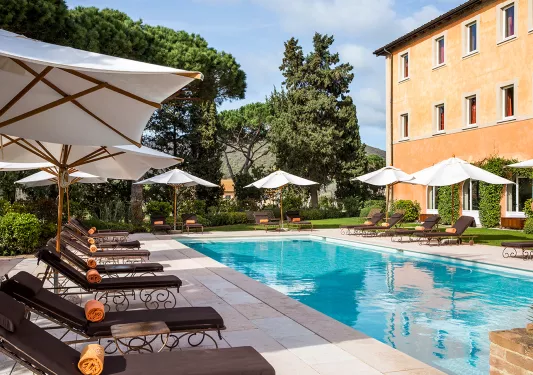 hotel pool with lounge chairs