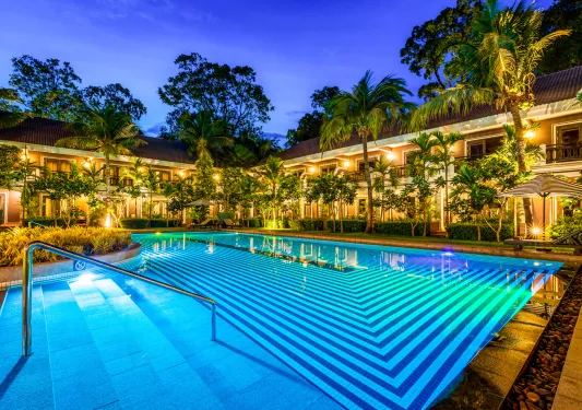 swimming pool lit up at night
