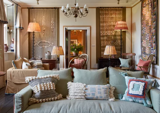blue couch in ornate living room