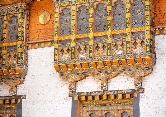Woman looking up at a temple building