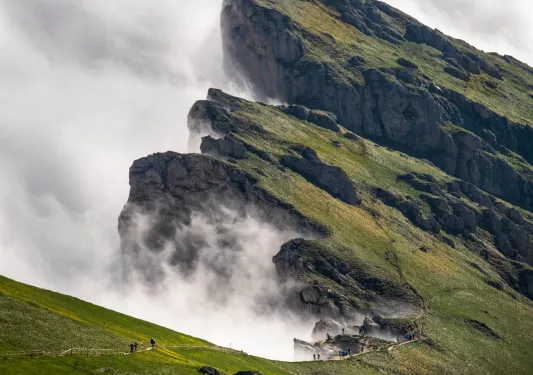 Large mountain with a foggy cliff at the edge
