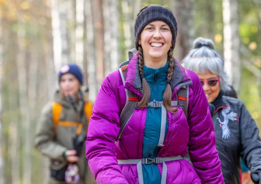 Group of women smiling with ascending in a forest