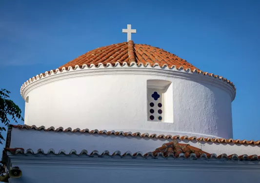 Bottom-top view of a church building with a cross on top