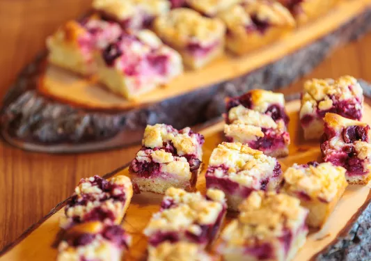 Berry pastries on a wooden plank