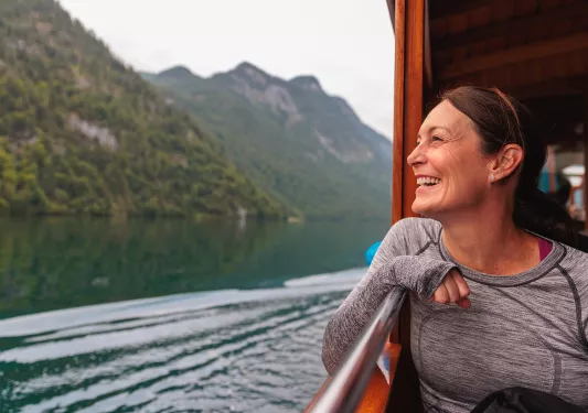 a person looking out onto the water from a boat