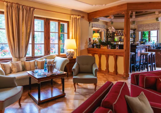 Indoor lounge with a wooden bar on the right