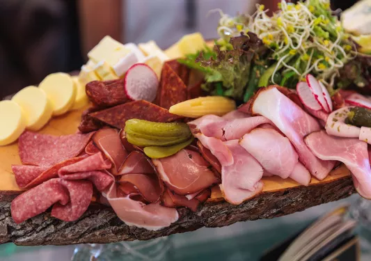 a platter of meats and cheeses