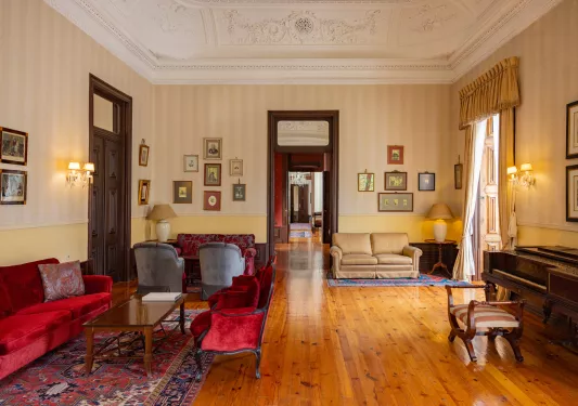 living room with wood floors and velvet couches