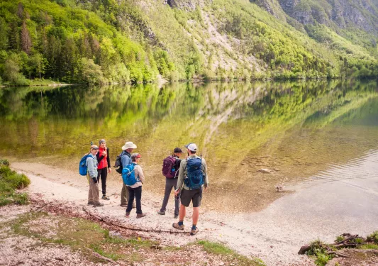 Hikers gather to admire a pond