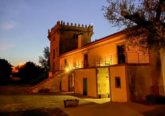 hotel at night lit up by lights