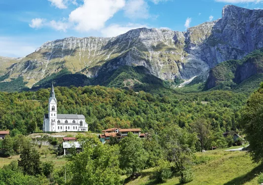 a church in front of a large mountain