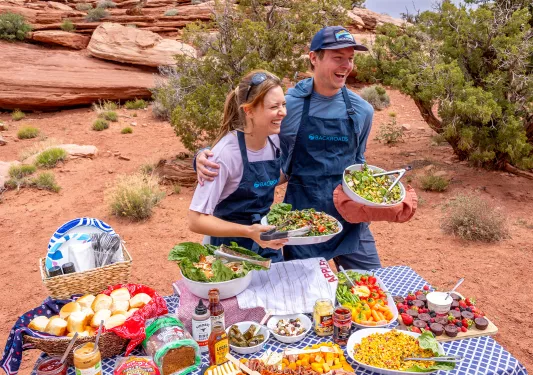 two trip leaders with a bountiful backroads picnic