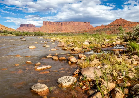a riverbed by canyons