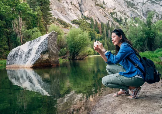 A hiker stops to take a photo