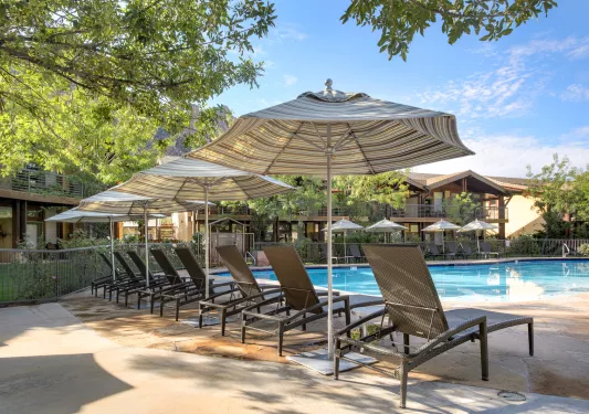 pool with lounge chairs