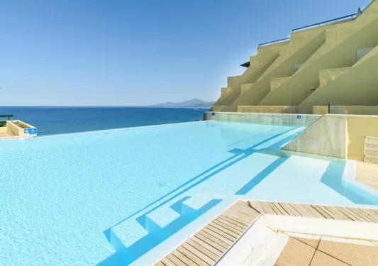 Outdoor pool with views of the vast ocean in the distance