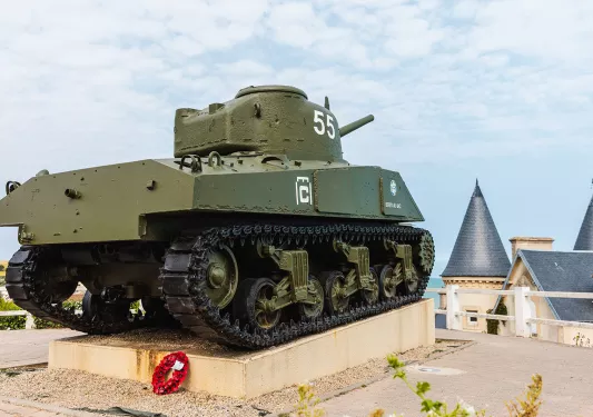 Dark green tank on the roof of a building