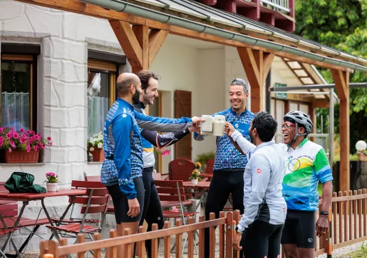 Group of men raiding beer steins and smiling