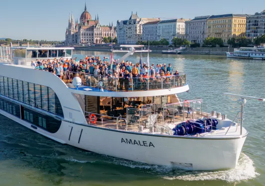 Giant boat with a large group of people on top, smiling