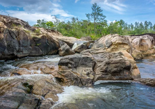 Large boulders with an active river