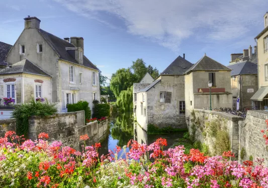 Gray, stone houses with a river connected all the houses