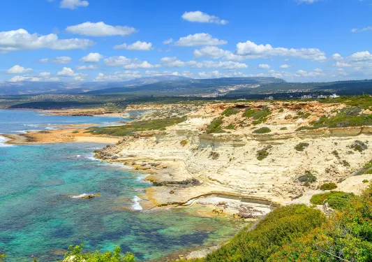 Large, yellow and orange cliffs overlooking the ocean