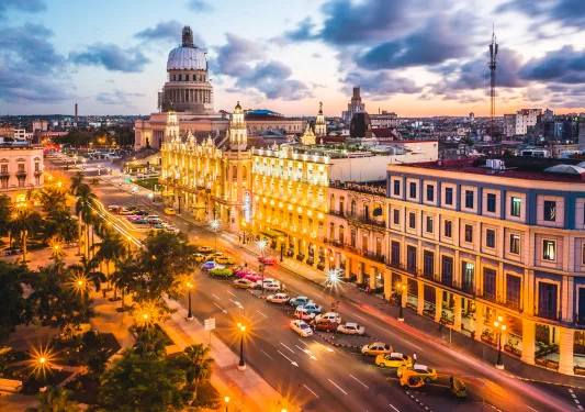 Exterior view of a town streets, illuminated by street lights