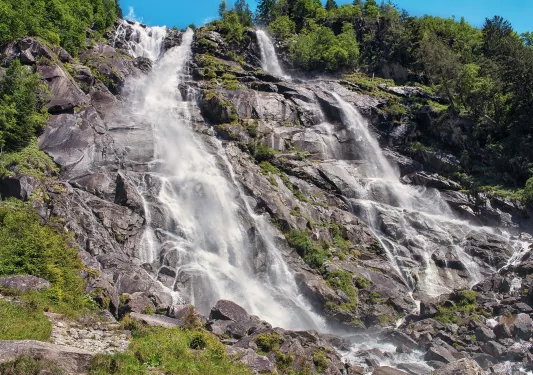 Large cliff with an active waterfall