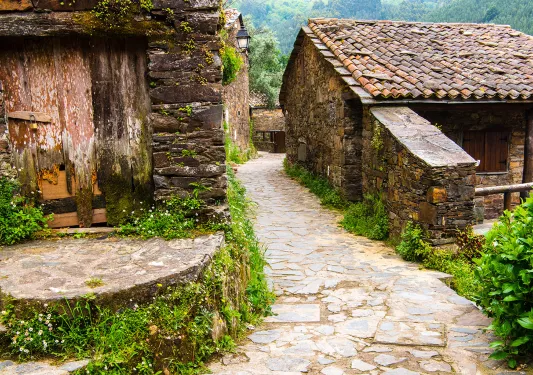 Walkways in between two stone and wood buildings