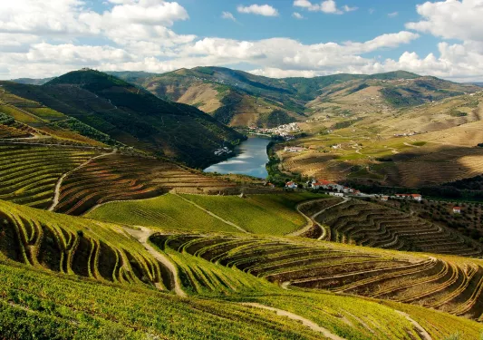 Valley with large hills and a river in the distance
