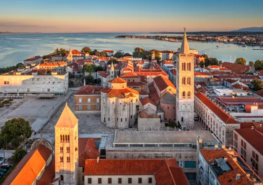 Sky view of town with the ocean in the background
