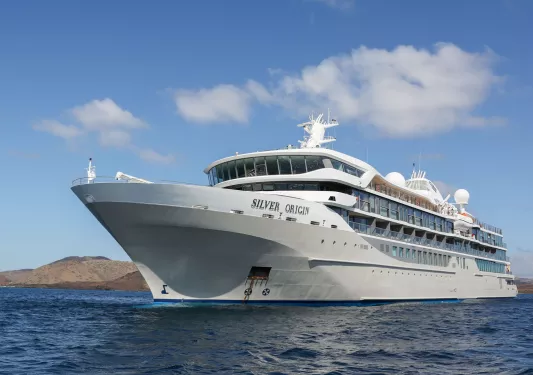 Exterior view of large, white boat on the ocean