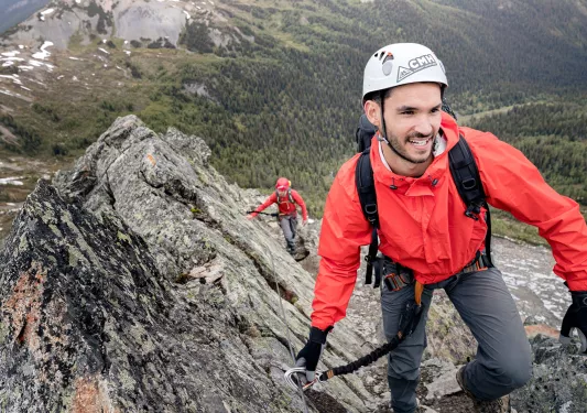 Backroads guests scaling a rocky mountain terrain