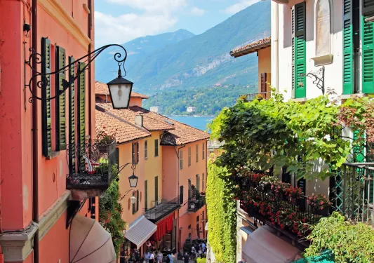 Alleyway of houses with mountains in the distance