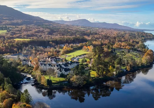 Sky view of a town with a lake in the front