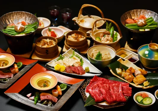 Small plates full of prepared, Japanese meals