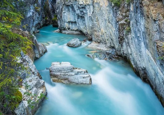 Blue water river in the middle of two large canyons