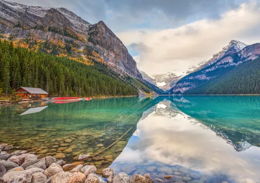 Lake with a reflection of the surrounding snow-capped mountains