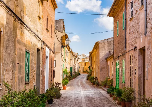 Stone alleyway with stone buildings on either side