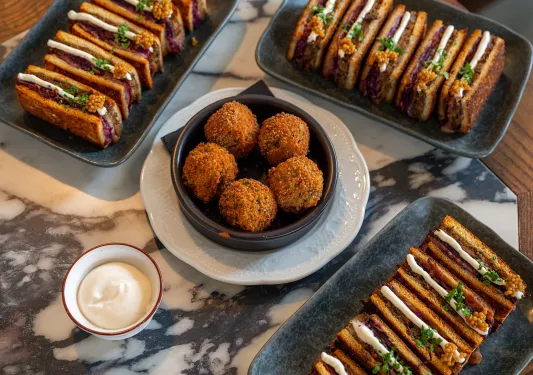 Dishes of fried foods on a table
