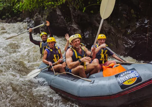 Group of people on a raft in an active river