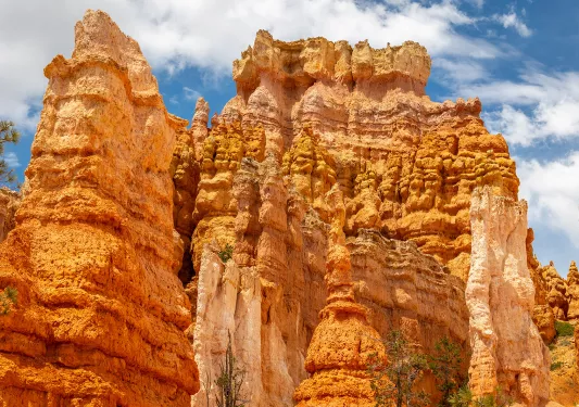 Large orange canyons in the middle of a valley of canyons