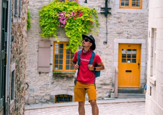 A backroads guests stops to admire buildings in Quebec