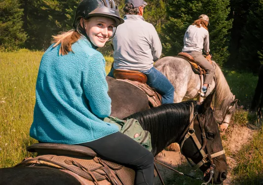 Backroads guests on a horseback ride