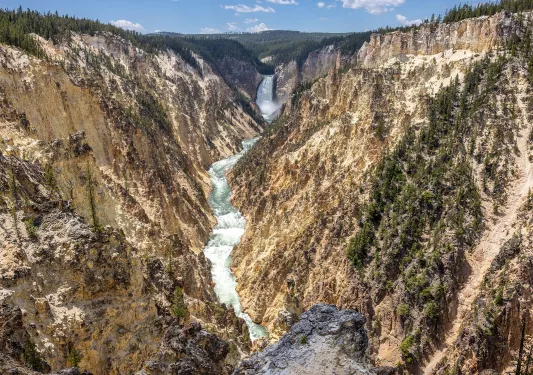 Active river cutting through two large mountains