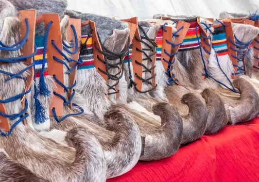 Boots covered with fur and leather side pieces on each boot