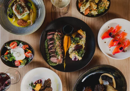 Plates of prepared fish and chicken