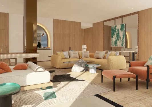 Room with wooden walls and white and brown cushioned sofas