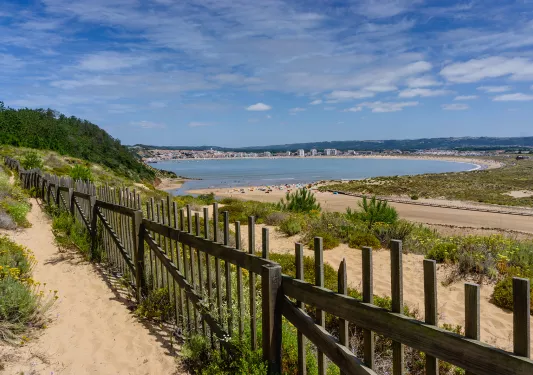 View of a beach in the distance, with people on the sand