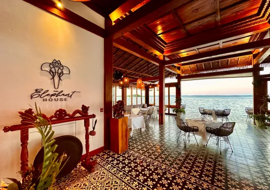 Entrance to hotel with view of ocean in the distance